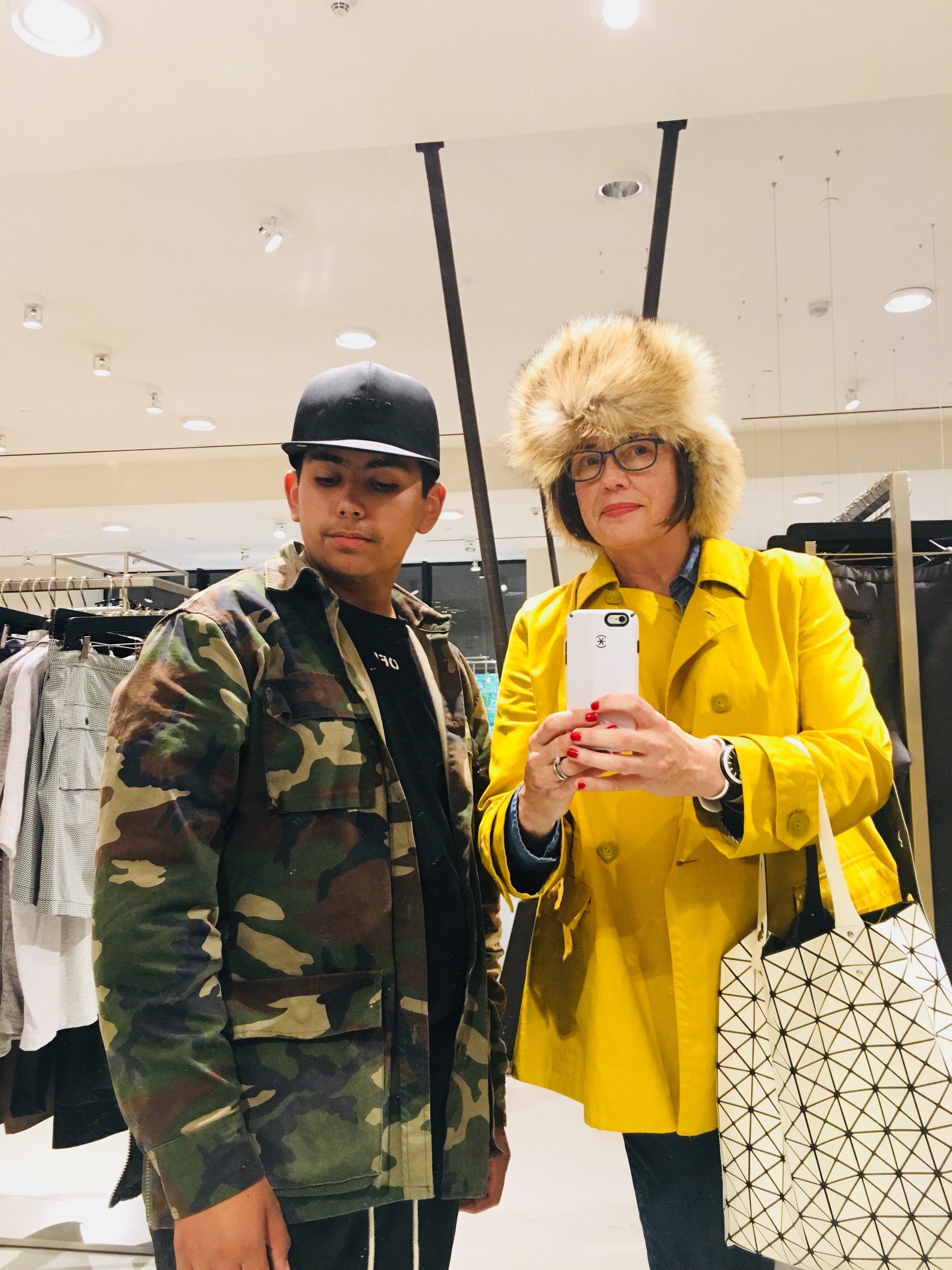 Shopping for hats with my son Rey